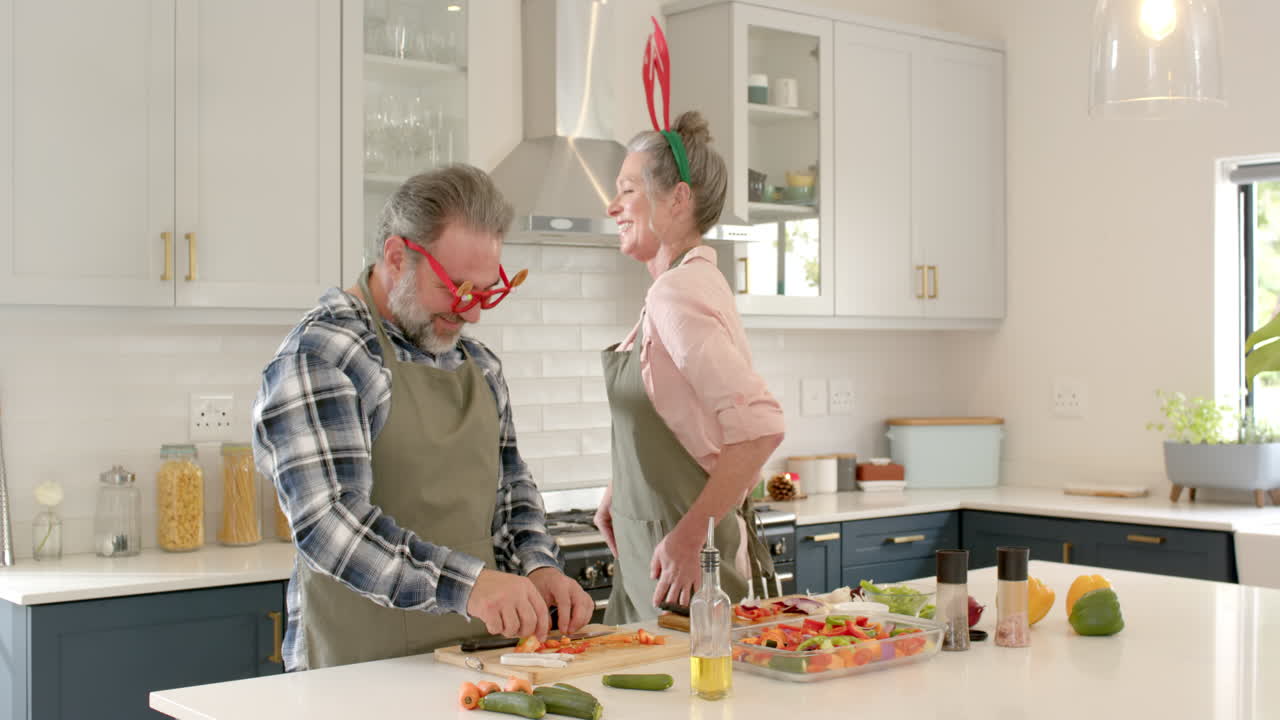 At Christmas, Festive couple preparing holiday meal together, smiling in cozy kitchen
