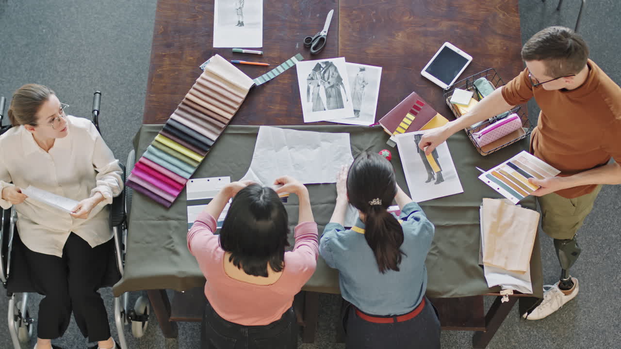Top View of Team of Fashion Designers Creating Collection