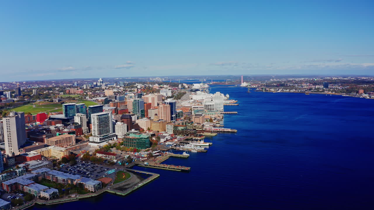 Aerial drone shot over Halifax downtown, Nova Scotia, Canada.
High view of the cityscape, ocean and the urban buildings.