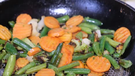 cooked vegetable mix. green beans and carrots. healthy diet.. cooking vegetarian food.