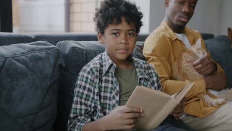 father and son reading together