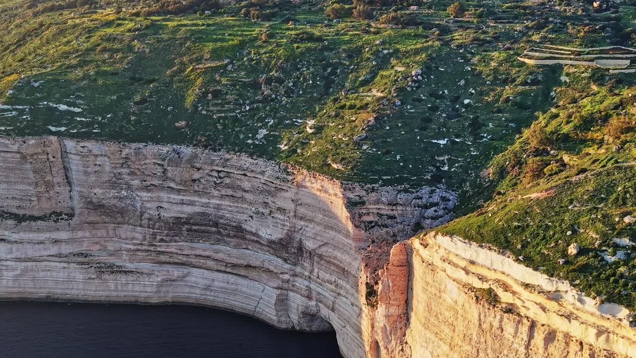 Cliffs of Malta reveal layered rock formations and greenery