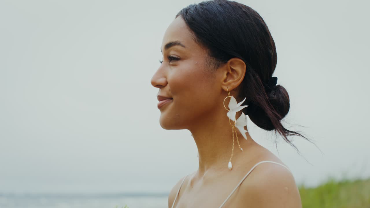 Elegant Bride on Beach with Wedding Bouquet