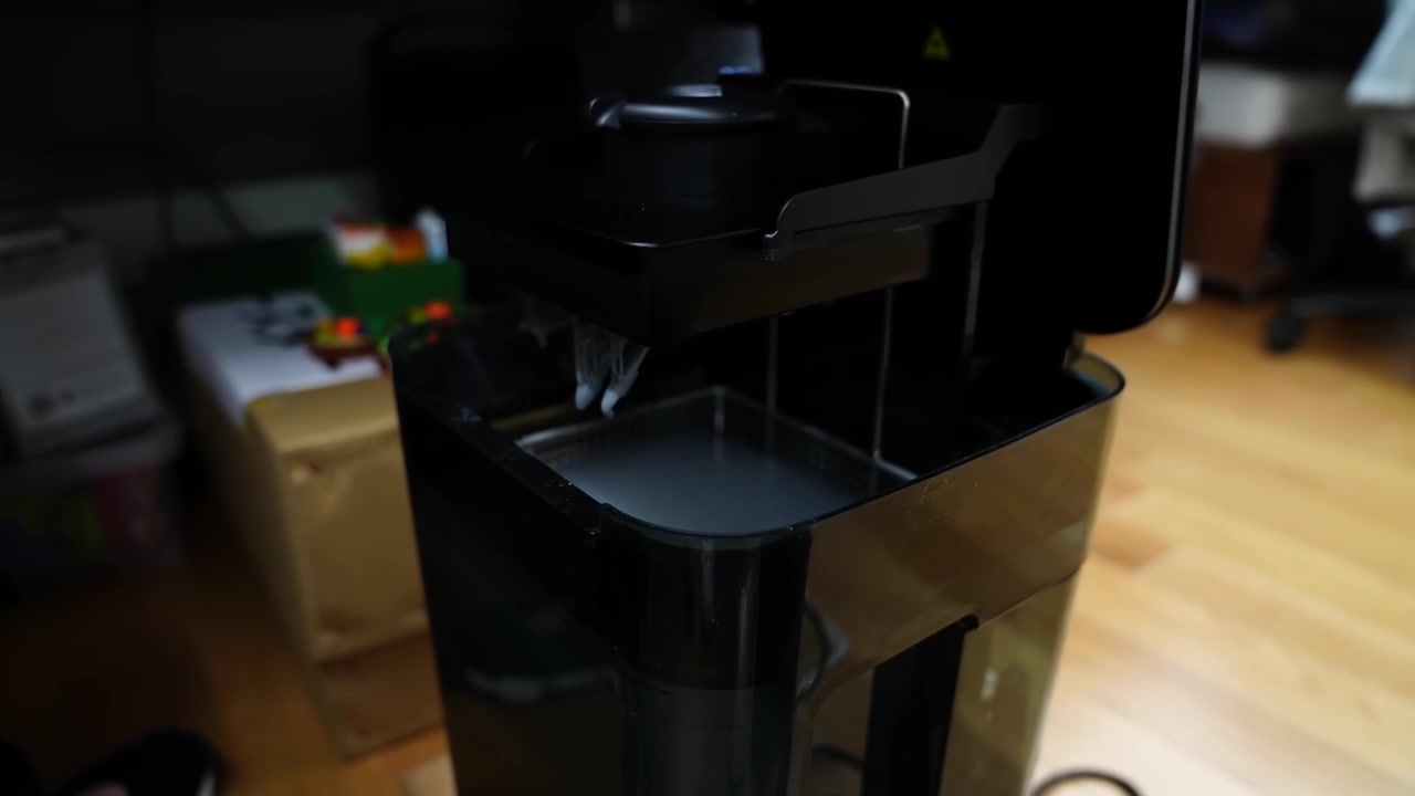 Translucent plastic mold cylinder inside eraser extrusion equipment at a Japanese rubber factory