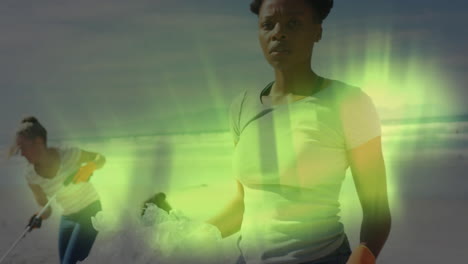 cleaning beach, woman surrounded by glowing green animation effect
