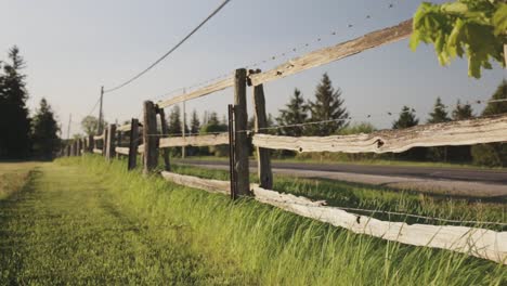 rack focus of a wooden fence on the countryside