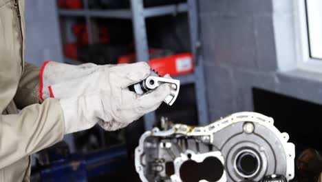 mechanic checking a car parts