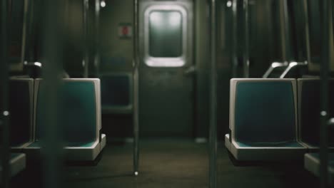 inside of the old non-modernized subway car in usa