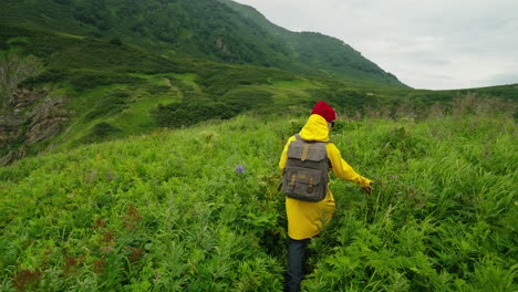 woman hiking in lush green mountains