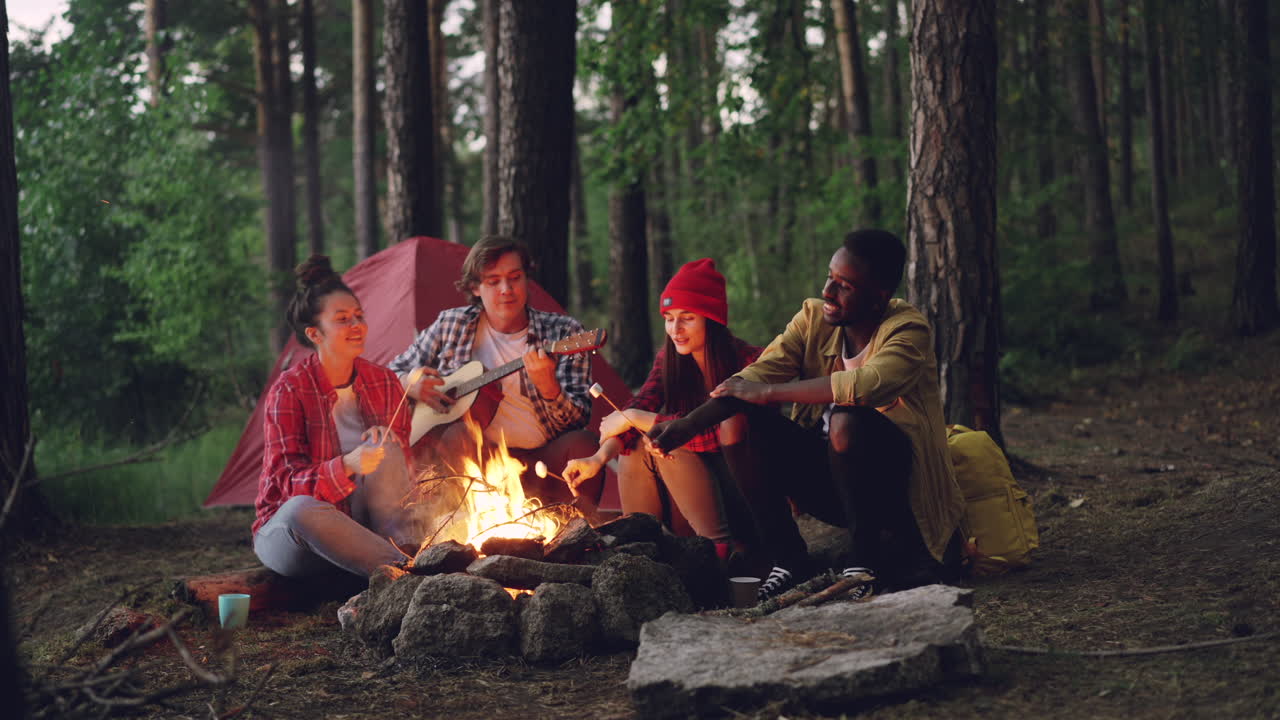 Friends Camping and Making Memories Around a Campfire