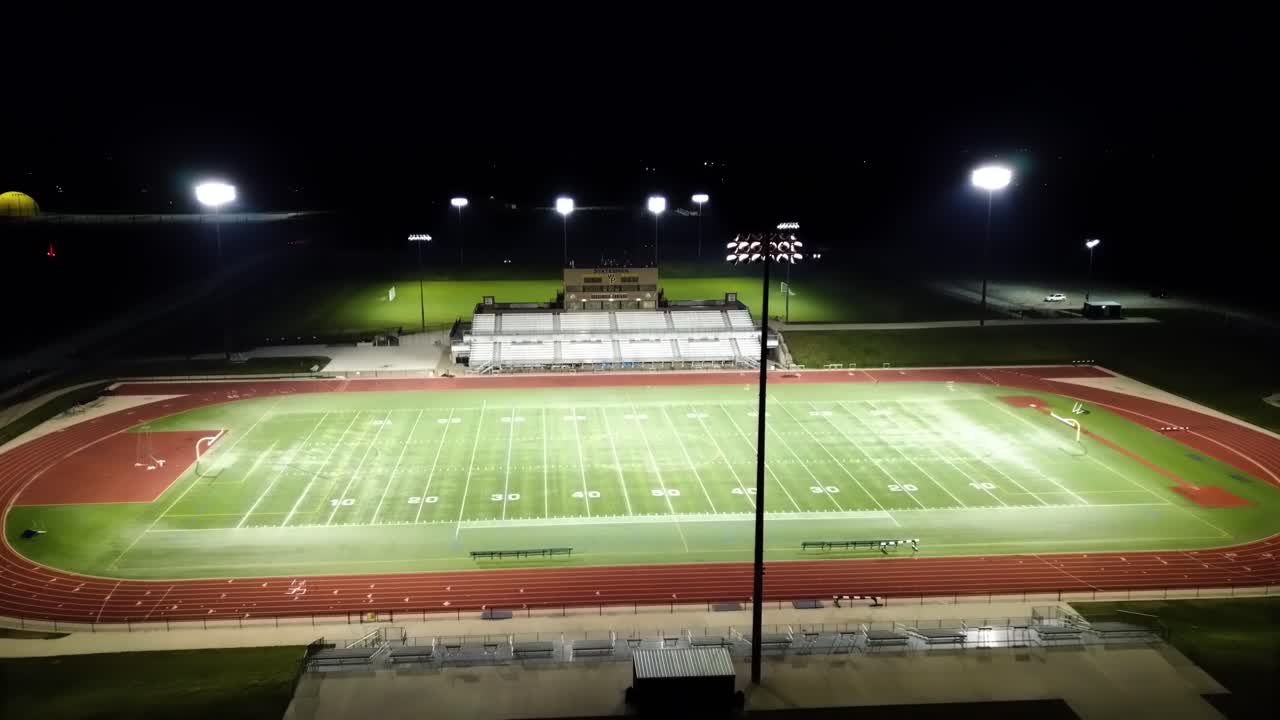 Nighttime Aerial Drone Footage Football Field At Statesmen Community Stadium William Penn University, Oskaloosa, Iowa