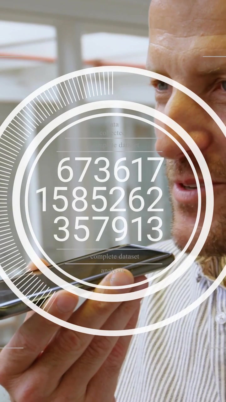 Professional man holding phone while speaking, HUD overlay updating numeric triplets for tech demo