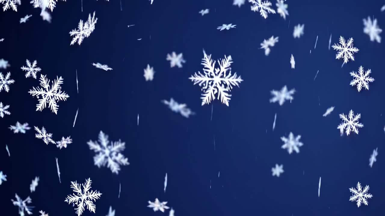 Video of snowflakes gently falling against a deep blue sky, captured from a low-angle perspective