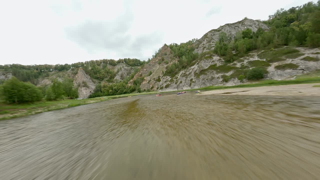 Holidaymakers at the recreation center take a walk on the water. Use small boats and rafts. The concept of outdoor equipment. Safety on the water.