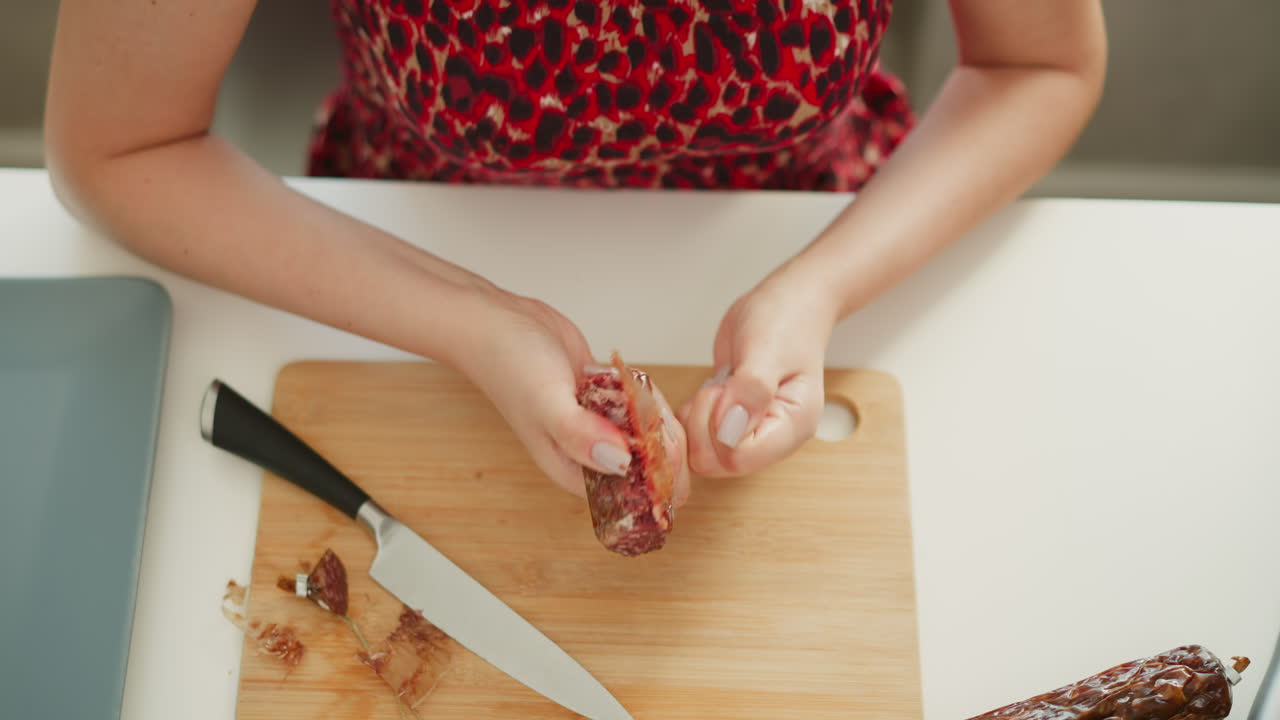 Woman preparing sausages