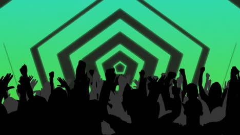 silhouetted crowd raising hands in the air with green hexagons and moving lights behind