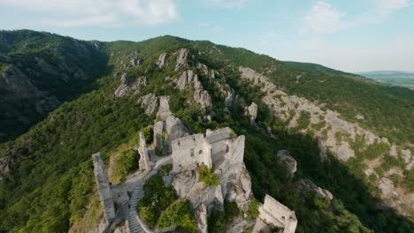 aerial drone shot of burgruine castle ruins, dürnstein, austrian european history, historical germanic site, river danube, middle ages midieval architecture, german kings, queens and bishops, fast fpv