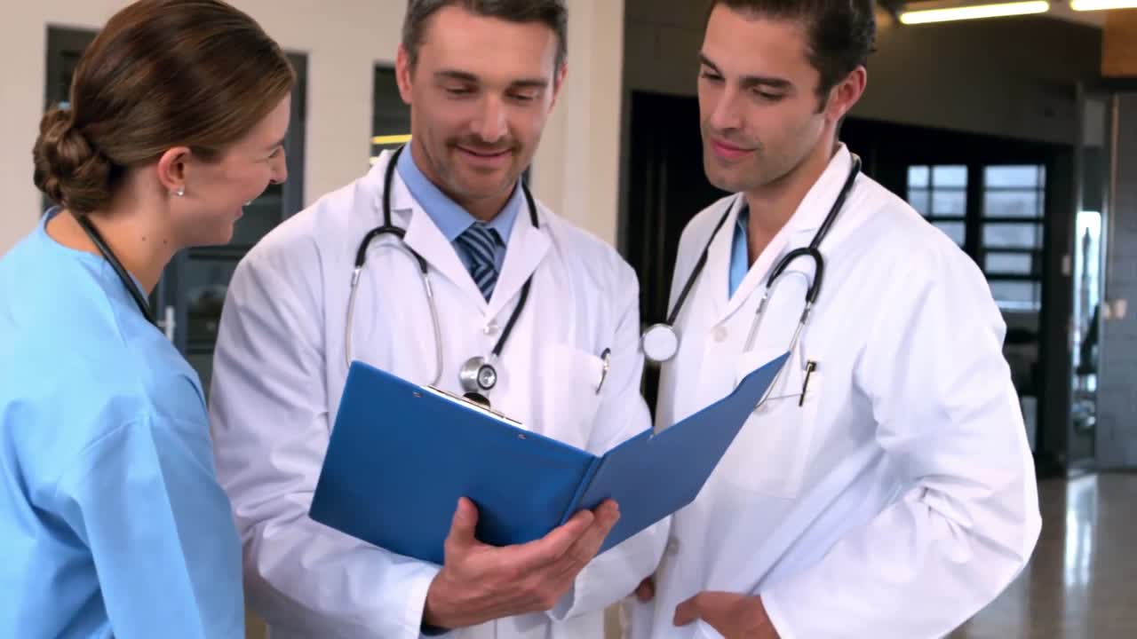 Doctors looking documents and talking