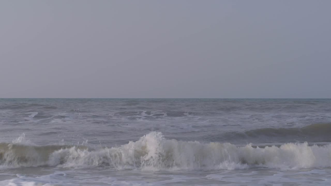 Waves of the Caribbean Sea breaking on the sandy beach