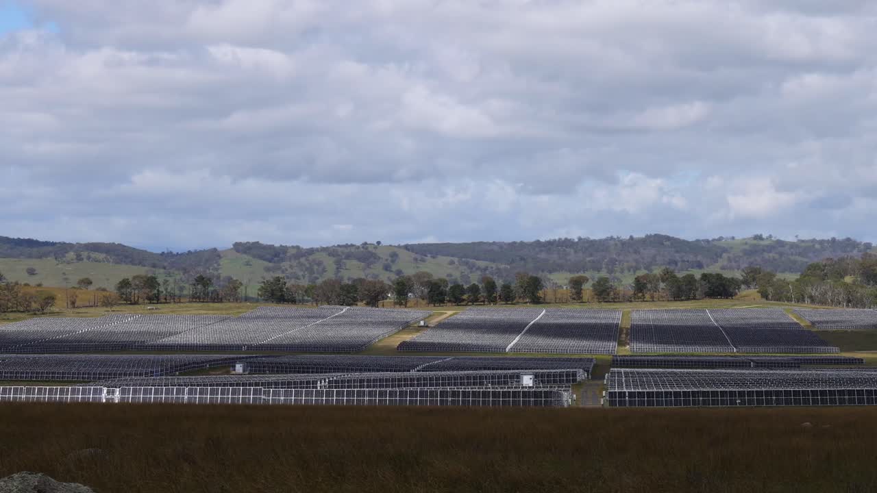 Time-lapse of solar panel installation in a field