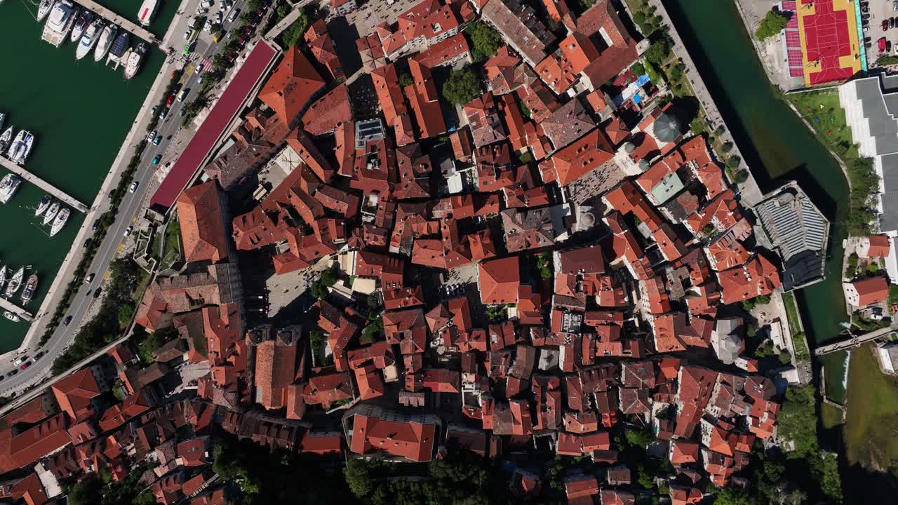 Old town rooftops in Kotor, Montenegro, viewed from above on a sunny day