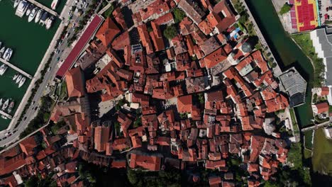 old town rooftops in kotor, montenegro, viewed from above on a sunny day