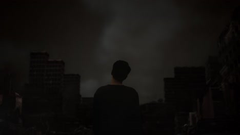 back view of distressed asian refugee male standing in the midst of a ruined city after a war. shaking his head being sad due to the war. the concept of refusal