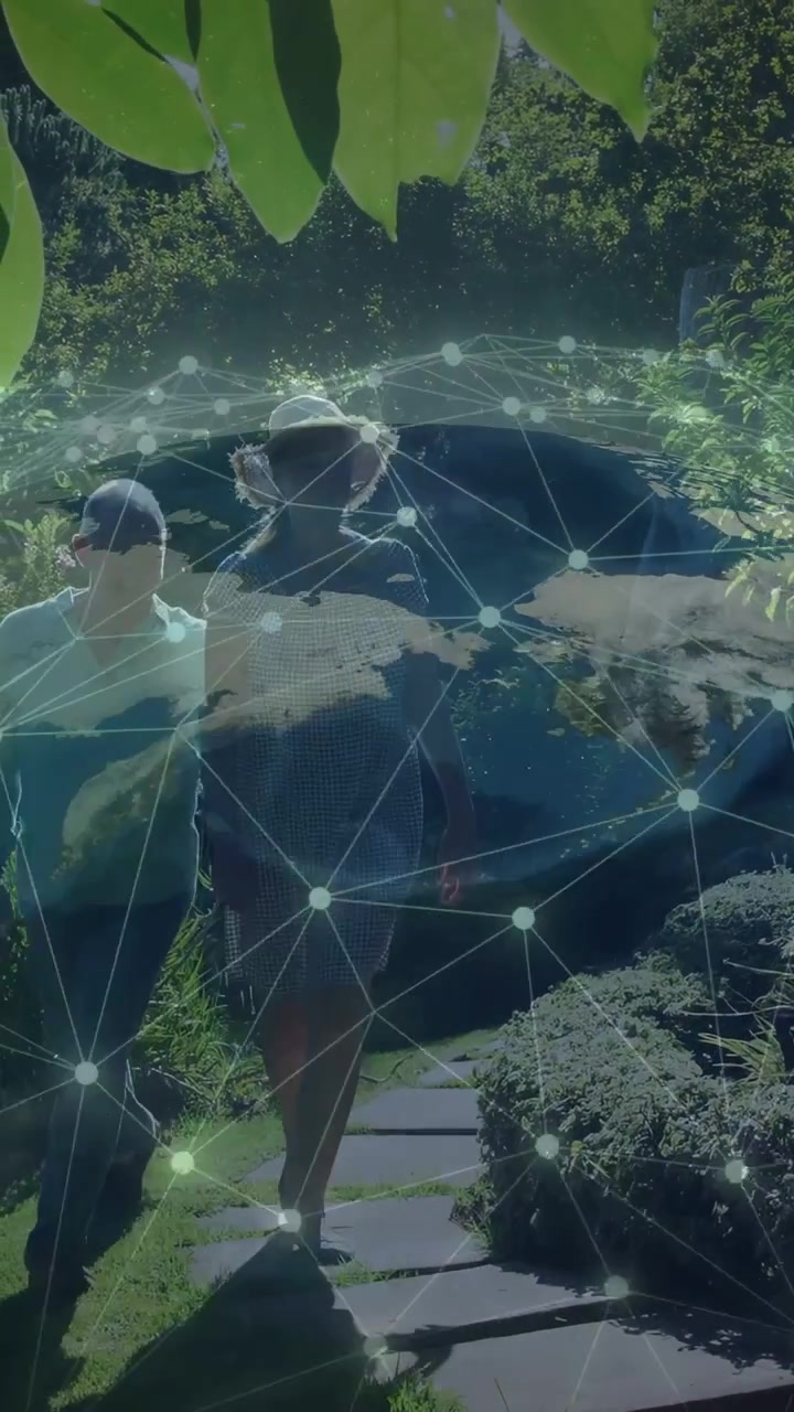 Vertical video: Sr duo entering linked walking for joy fixing hat globe over duo showing net for IT