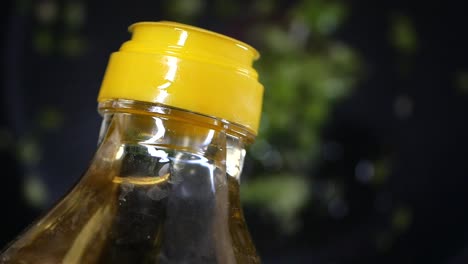 close-up of a bottle with yellow cap