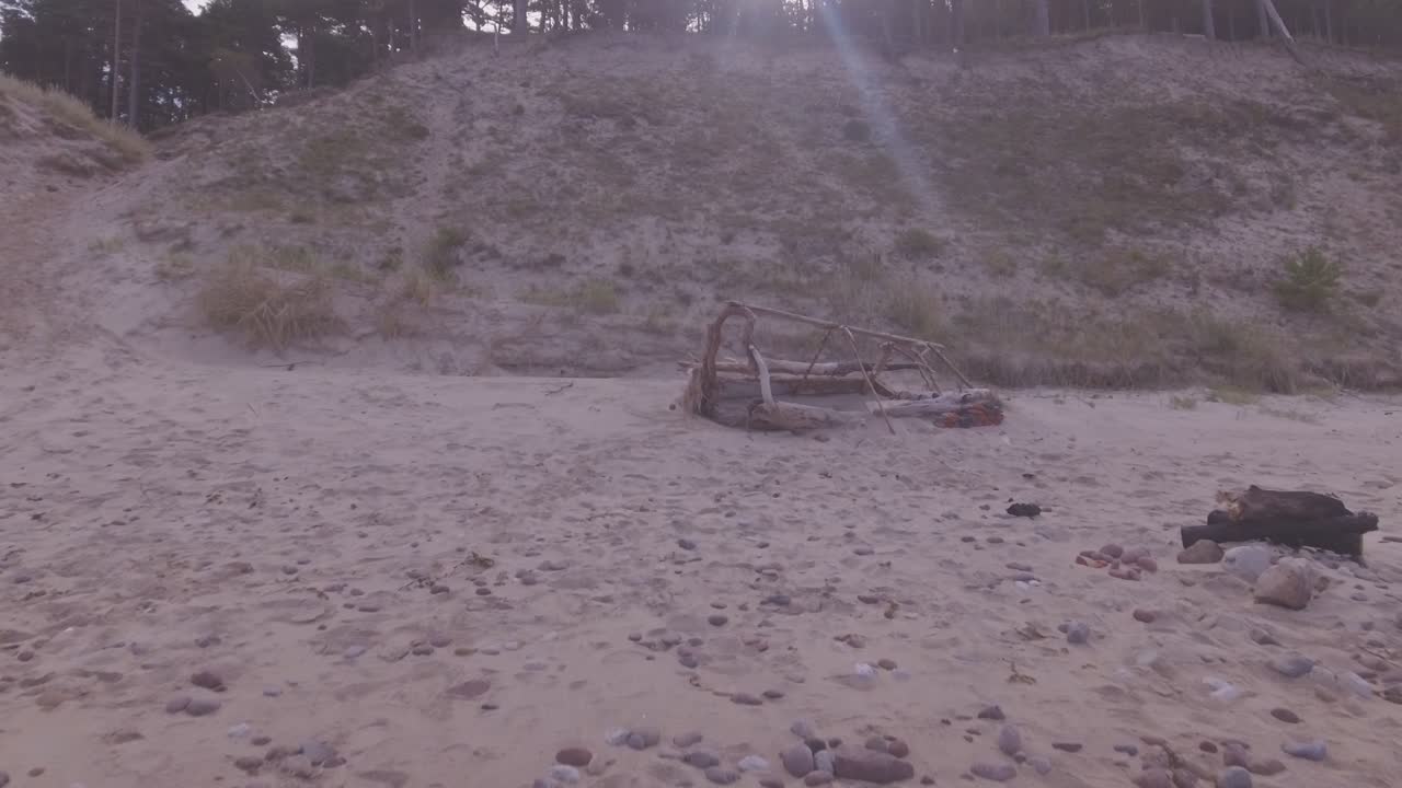 Construction Made by Holidaymakers From Wood Thrown At The Seaside Beach