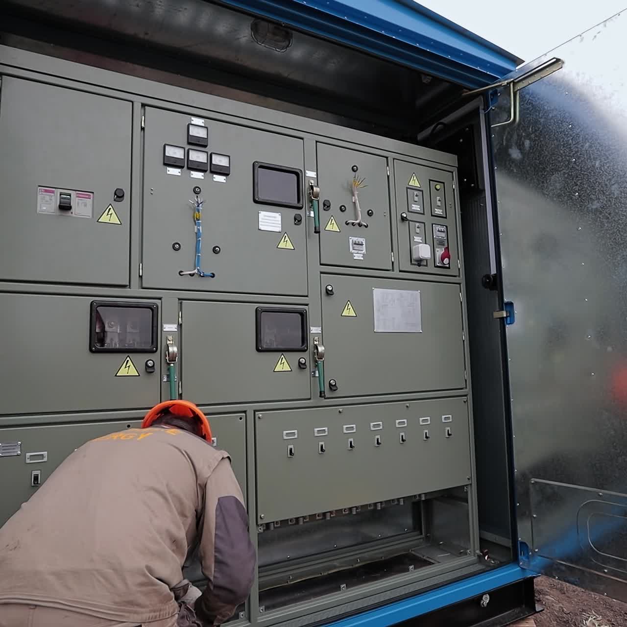 Specialists checking electic supply. Electric station engineer instalation