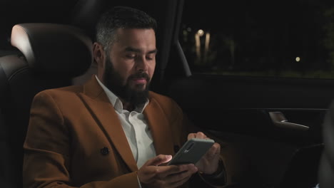 businessman in a car at night