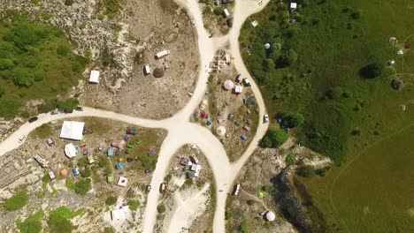 a bird'seyeview shows tents set up for the borderland festival in denmark