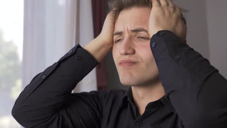 unhappy angry young man is depressed.