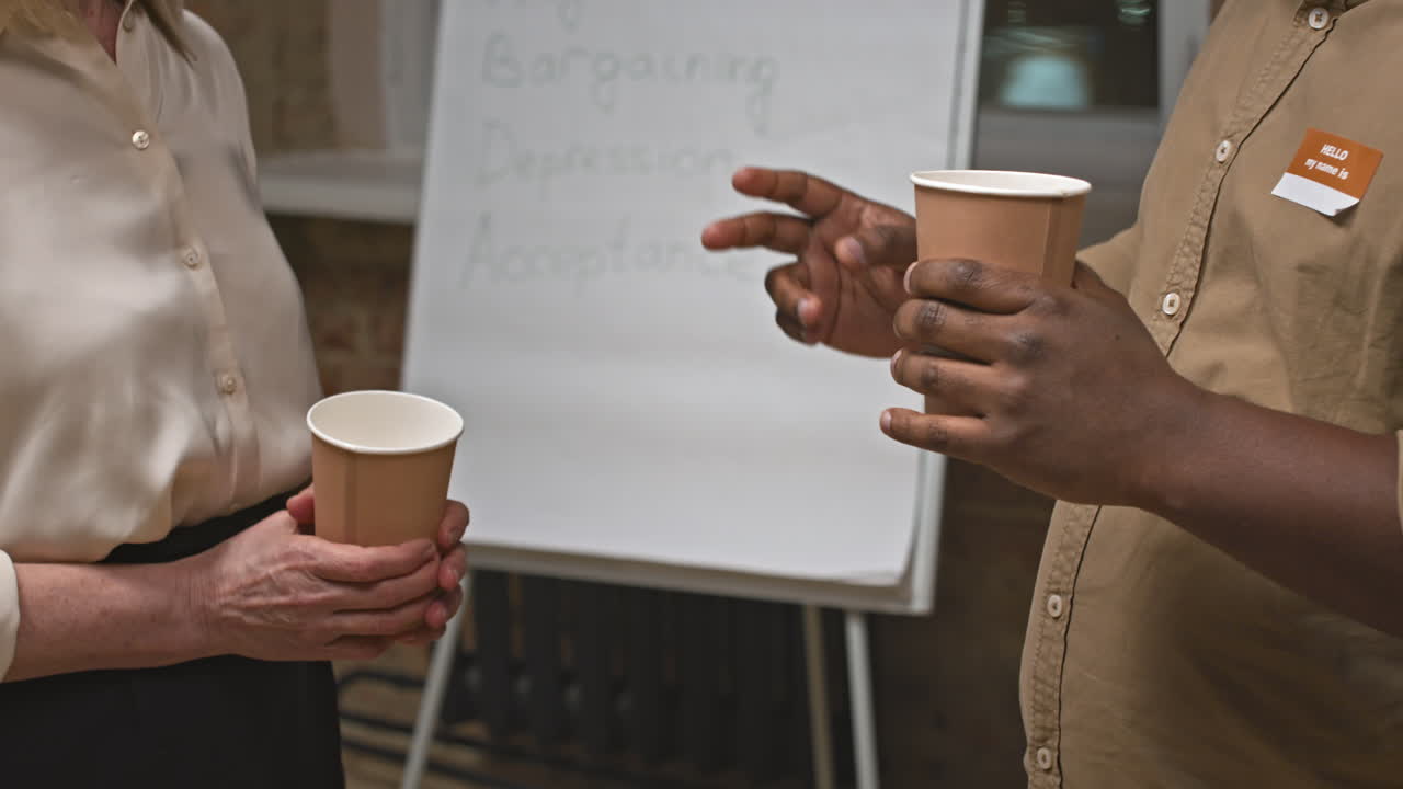 Midsection of People Talking at Therapy Session