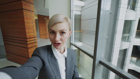 business woman selfie in modern office