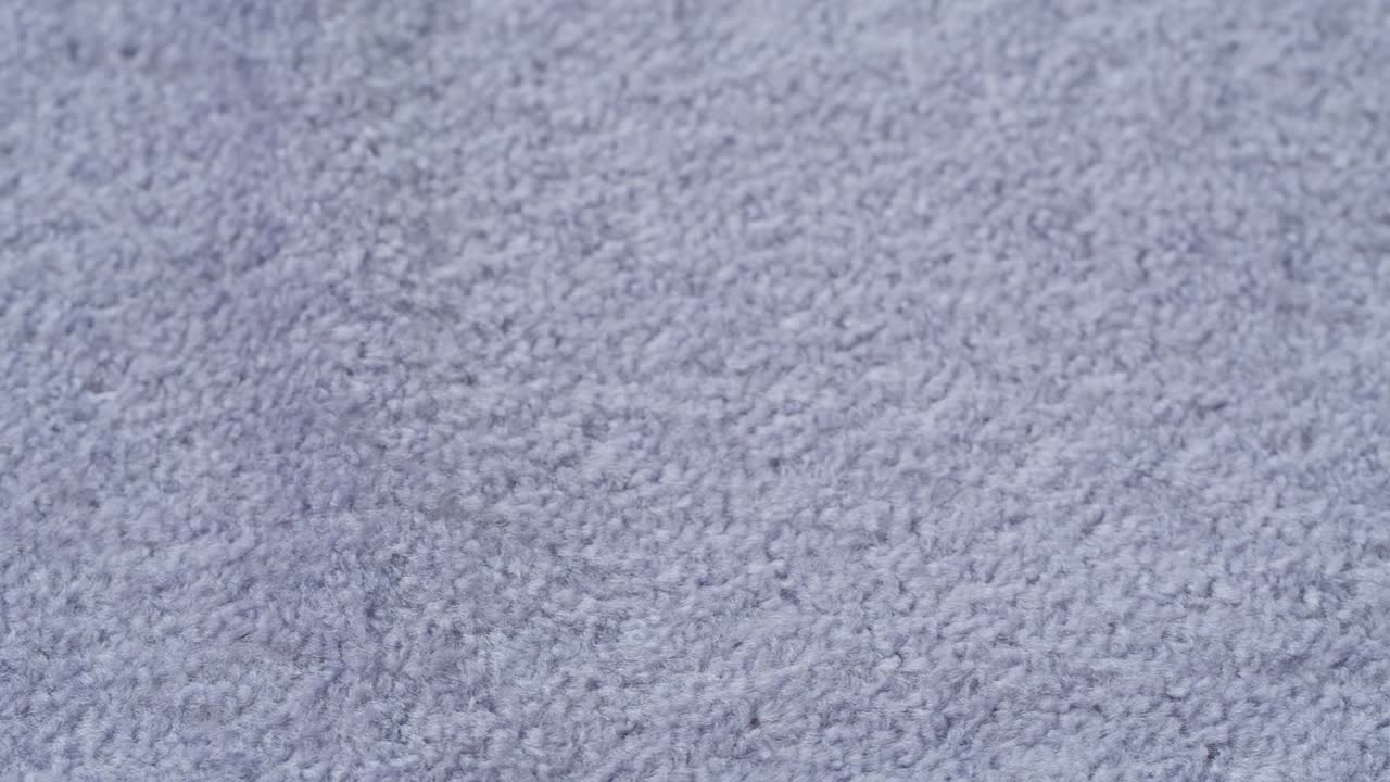Close-up of Soft Light Blue Carpet Texture