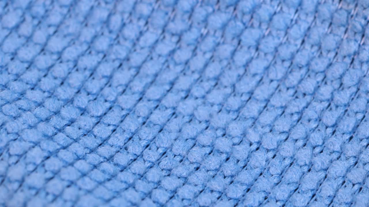 파란색 행주 재료의 매크로 샷, 매크로 샷은 세부 뷰 회전 동작을 닫습니다.