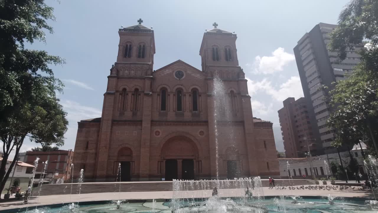 Metropolitan Catholic Cathedral Shining Sun Clear Day on Medellin Colombia Town Church Neighborhood Water flowing in the Fountains