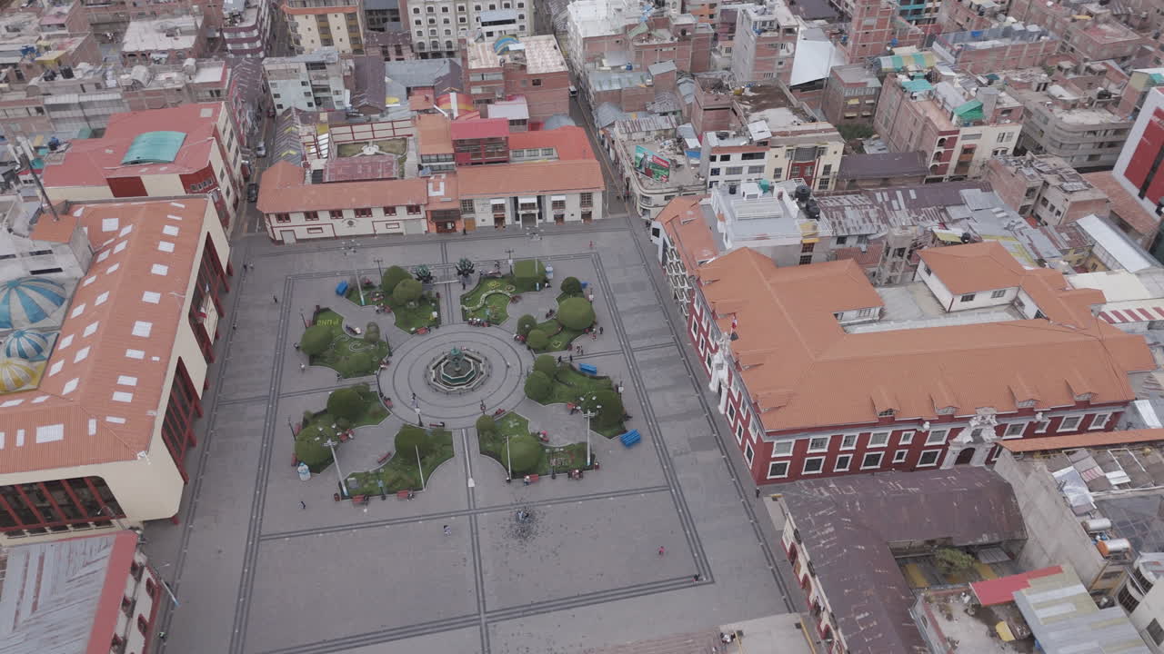 Drone shot above Plaza Mayor de Puno Peru near the church or cathedral LOG