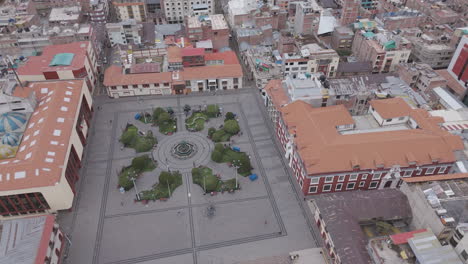 drone shot above plaza mayor de puno peru near the church or cathedral log