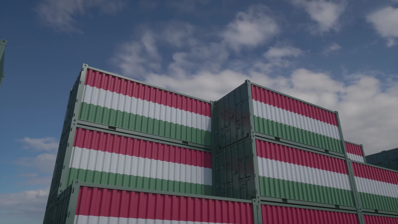 Hungary flag containers are located at the container terminal. Hungary export or import concept, 4K