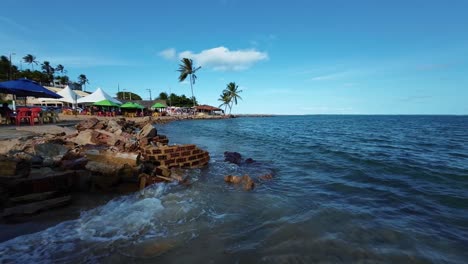 Dolly-in-action-camera-shot-of-the-beautiful-tropical-tourist-destination-Barra-de-Cunhaú-beach-in-the-small-coastal-city-of-Canguaretama-near-Pipa-and-Natal-in-Rio-Grande-do-Norte,-Brazil