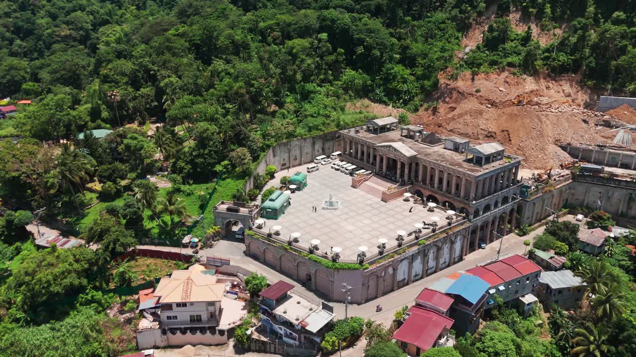 4K aerial drone footage of an impressive architectural landmark surrounded by lush tropical forest in Cebu, Philippines. Ideal for travel, tourism, architecture, real estate, and cultural heritage