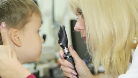 professional ophthalmologist checks the eyesight of the child. eye examination
