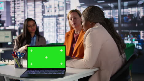 business meeting with green screen laptop