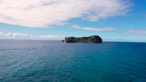 low angle drone shot of a small island, near são miguel island, portugal