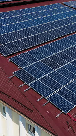 aerial view. top view on blue solar pannels. green energy. pannels on the roof. vertical video