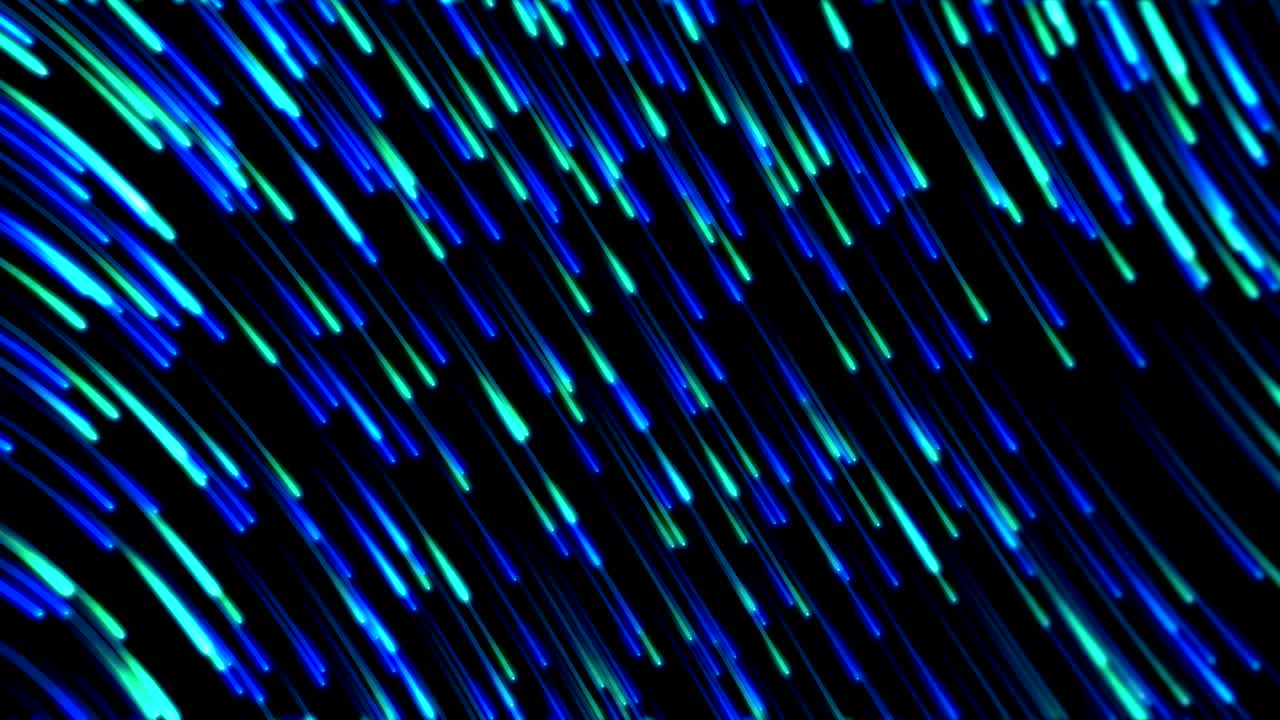 Animation of multiple glowing lights trail against black background