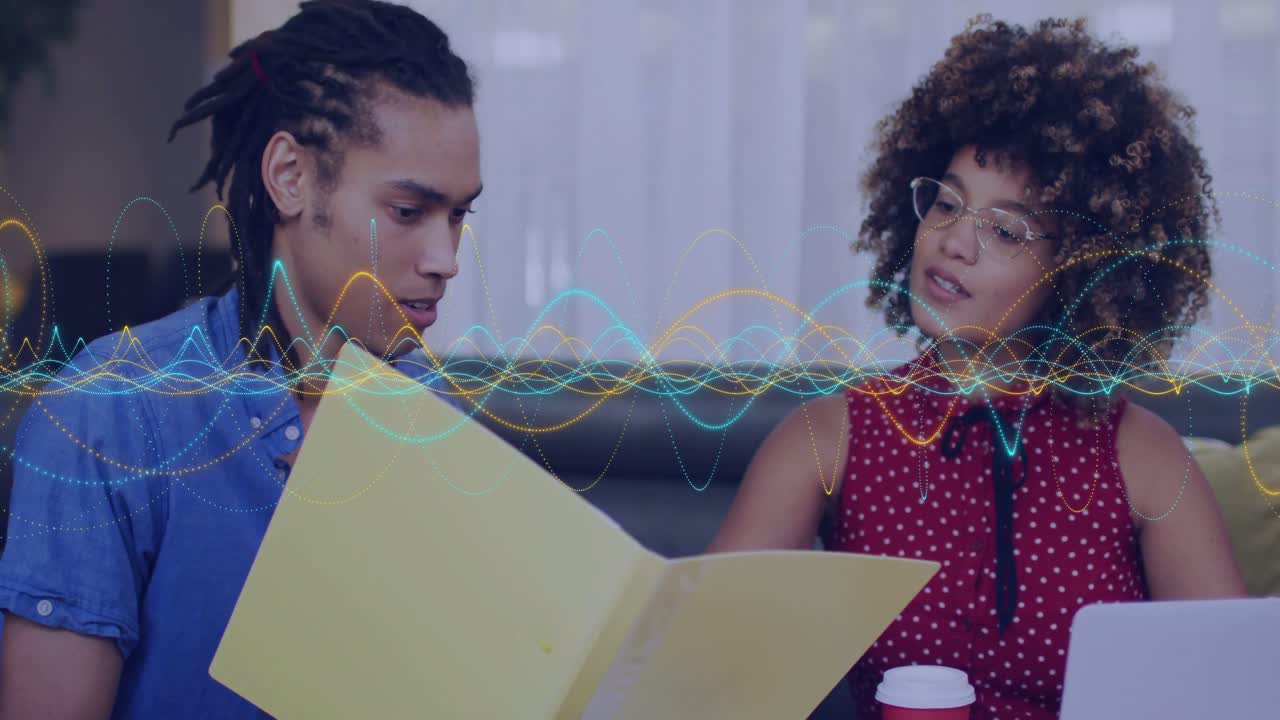 Male opening yellow folder, female leaning in, animated waveform guiding laptop business review
